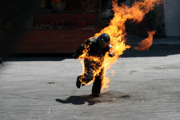 A stunt performer on fire