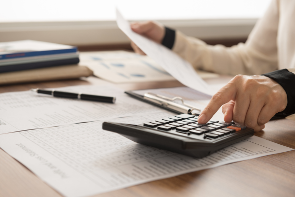An accountant using a calculator