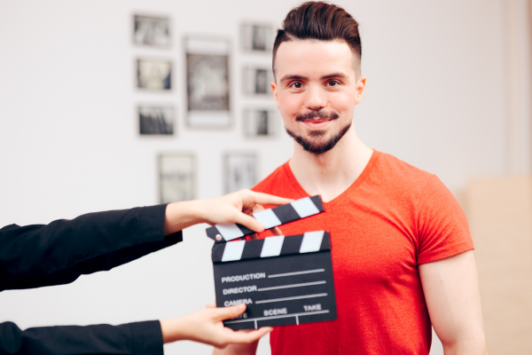 An actor poses for a video